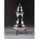 A LARGE INTER-WAR YEARS SILVER SUGAR CASTOR, with attractively pierced cover and scrolliated rim,