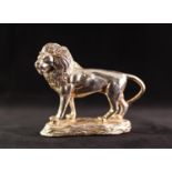 MODERN SILVER COLOURED METAL CLAD RESIN MODEL OF A STANDING LION on naturalistic base, 5 1/4" (13.