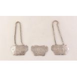PAIR OF VICTORIAN SILVER SPIRIT LABELS Whiskey and Gin, cartouche shaped and foliate scroll engraved