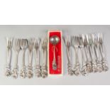 SET OF THIRTEEN GERMAN SILVER COLOURED METAL CAKE FORKS, with double sided rustic handles with