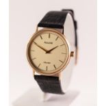 A 9CT GOLD CASED ACCURIST QUARTZ WRISTWATCH The circular shape gold tone dial with baton hour