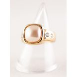 GOLD PLATED COSTUME RING, set with mother o'pearl and two tiny white stones to each shoulder and a