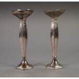 A PAIR OF INTER-WAR YEARS WEIGHTED SILVER FLOWER VASES OF HEXAGONAL SHAPE, with petal shaped rim,