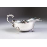 GEORGIAN STYLE SILVER SAUCE BOAT, of typical form with cyma border, flying scroll handle and