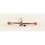 SMALL GOLD COLOURED METAL SAFETY PIN BROOCH collet set to a sprig pattern centre with an oval