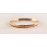 9ct GOLD HINGE OPENING HOLLOW BANGLE, with diamond cut decoration, in case 5.5gms