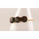 9ct GOLD RING WITH A ROW OF FIVE ROUND, CHEQUERBOARD CUT ANDESINE LABRADORITES, each in a four