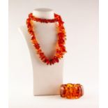 BALTIC CHIP AMBER NECKLACE OF GRADUATED CHIP AMBER BEADS and an expanding BRACELET OF TWELVE LARGE