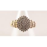 9ct GOLD AND DIAMOND DOMED CLUSTER RING, with four tiers of numerous tiny diamonds and three tier