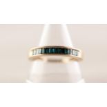 9ct GOLD AND BLUE HALF ETERNITY RING set with seventeen baguette cut stones 2 - 3 gms ring size R
