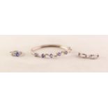 SUITE OF TANZANITE AND SILVER JEWELLERY, comprising; a BANGLE, set with 5 oval cut tanzanite's