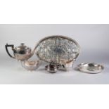 THREE PIECE ELECTROPLATED TEASET, of oval, part fluted form with black angular scroll handle and