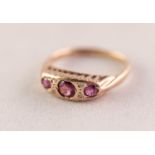 9ct GOLD RING, the lozenge shaped top gypsy set with three amethysts and two pairs of tiny diamonds,