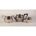 H&H ELECTROPLATED TEA SERVICE of three pieces, oval and semi lobed comprising of teapot with flush