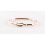 GOLD COLOURED METAL, UNMARKED, BANGLE, set with a tiny diamond in 'Touch' wooden box, 5.9gms