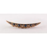 A TWENTIETH CENTURY 9ct GOLD CRESCENT SHAPE BROOCH, set with six tiny diamonds and six sapphire blue