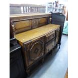 AN EARLY TWENTIETH CENTURY JACOBEAN REVIVAL OAK SIDEBOARD