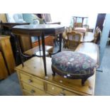 AN EDWARDIAN MAHOGANY AND CROSSBANDED OCTAGONAL TWO TIER OCCASIONAL TABLE AND AN OVAL FOOTSTOOL,