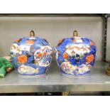 A PAIR OF ORIENTAL OVULAR JARS AND LIDS, IN IMARI PALETTE