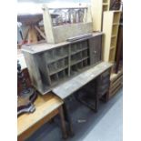 AN OAK SINGLE PEDESTAL DESK, A TAMBOUR FRONTED CABINET WITH PIGEON HOLES (A.F.)