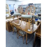 A LATE 1950's/EARLY 1960's LIGHT WOOD ERCOL DINING ROOM SUITE OF TABLE, FOUR STICK BACK CHAIRS,