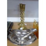 A PAIR OF BRASS DOUBLE SPIRAL TWIST STEMMED CANDLESTICKS, AND AN ELECTROPLATED SAUCE BOAT ON STAND