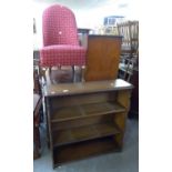 A THREE TIER OPEN BOOKCASE AND AN UPHOLSTERED SPOON BACKED BOUDOIR EASY CHAIR