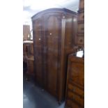 A GENT?S BUTILUX MAHOGANY TWO DOOR FITTED WARDROBE WITH ARCHED TOP, ON STUMP CABRIOLE SUPPORTS