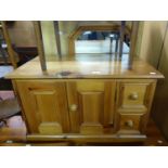 A MODERN PINE SMALL CUPBOARD, HAVING TWO SIDE DRAWERS, A SMALL OPEN BOOKCASE AND AN OCTAGONAL WALL