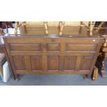 A NINETEENTH CENTURY OAK FIELDED PANEL CHEST WITH HINGED TOP