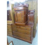 AN EARLY TWENTIETH CENTURY MAHOGANY DRESSING TABLE, WITH SWING MIRROR AND A BEDSIDE CABINET (2)