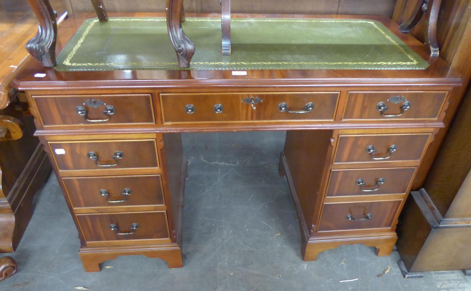 A MAHOGANY TWIN PEDESTAL DESK, WITH GREEN LEATHER INSET TOP