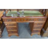 A MAHOGANY TWIN PEDESTAL DESK, WITH GREEN LEATHER INSET TOP