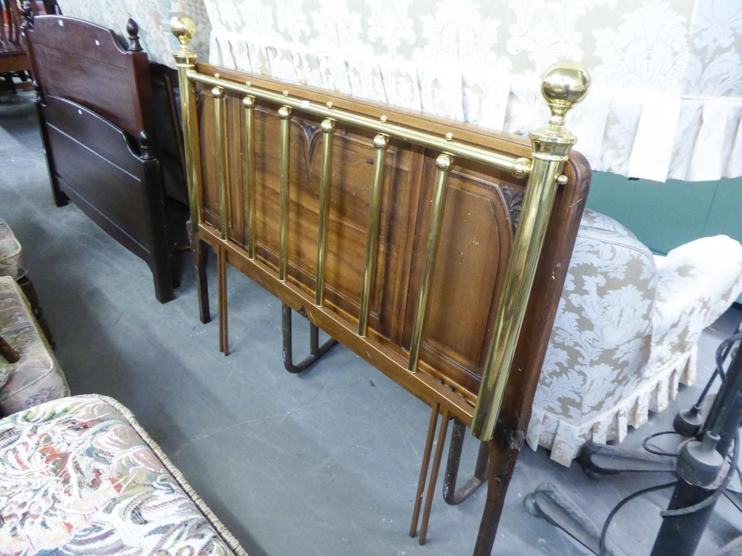 A BRASS HEADBOARD AND A MAHOGANY EXAMPLE