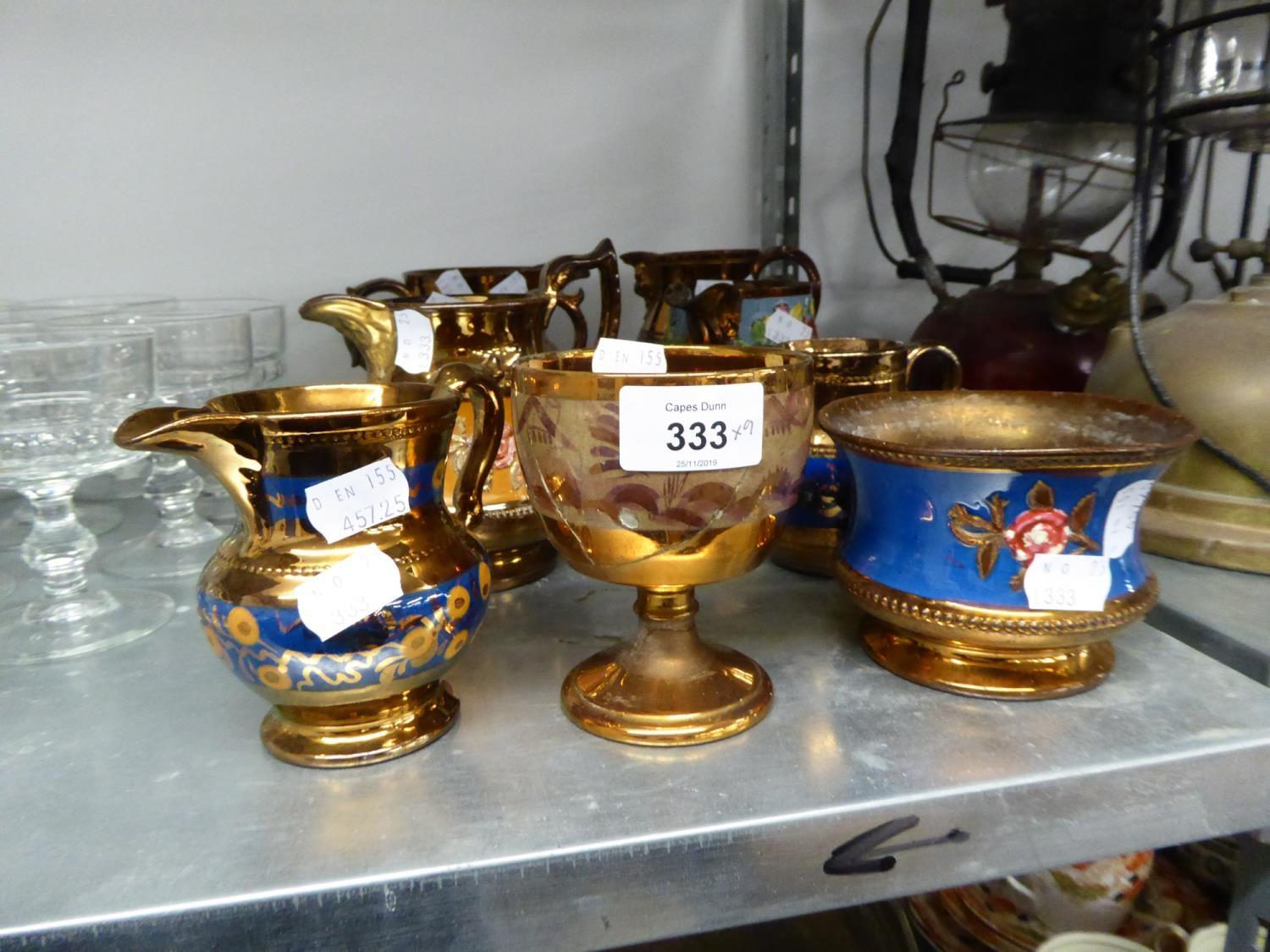 A QUANTITY OF COPPER LUSTRE WARES, JUGS AND POTS (9)