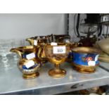 A QUANTITY OF COPPER LUSTRE WARES, JUGS AND POTS (9)