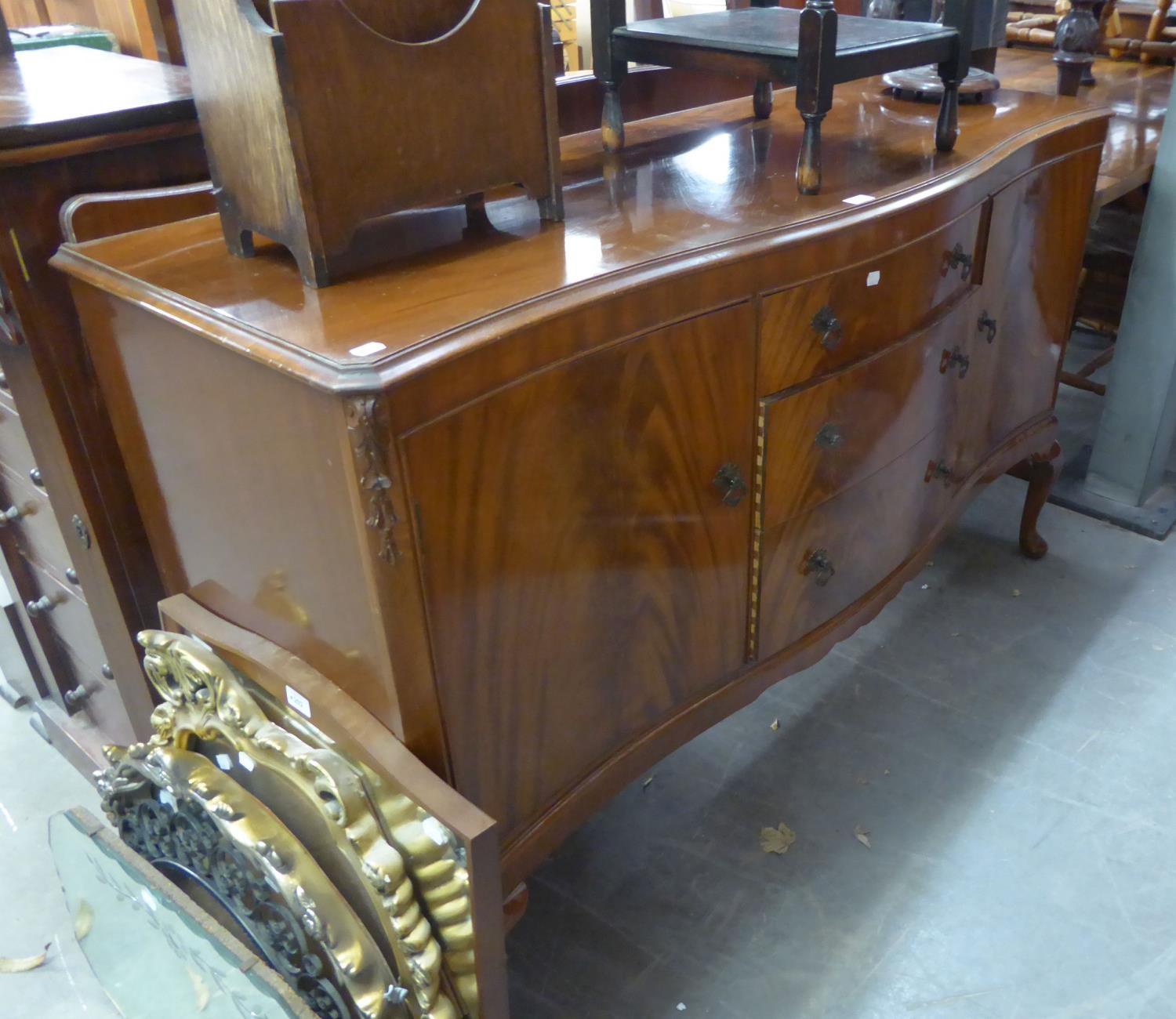 A LATE 1930's/POST WAR SERPENTINE FRONT SIDEBOARD