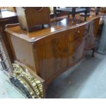 A LATE 1930's/POST WAR SERPENTINE FRONT SIDEBOARD