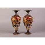 PAIR OF EARLY CARLTON WARE POTTERY PEDESTAL VASES, each of slender ovoid form with waisted neck