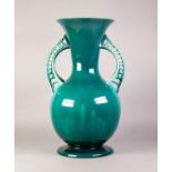 LINTHORPE POTTERY TALL TWO HANDLED VASE with trumpet neck , spreading circular base, openwork