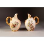 TWO ROYAL WORCESTER CHINA JUGS OF MATCHING SHAPE, each of footed ovoid form with cut-out spout and