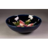 EARLY WALTER MOORCROFT POTTERY HIBISCUS PATTERN SHALLOW BOWL, painted initials and impressed marks