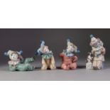 FOUR NAO FIGURES OF YOUNG CLOWNS, all modelled either seated or reclining, one modelled with