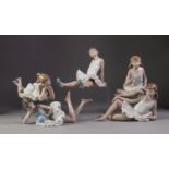 FIVE NAO PORCELAIN FIGURES OF YOUNG BALLERINAS, all modelled either seated or reclining, 6? (15.2cm)