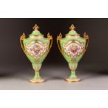 PRETTY PAIR OF EDWARDIAN ROYAL CROWN DERBY PORCELAIN TWO HANDLED VASES, each with a floral enamelled