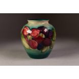 MOORCROFT OVOID VASE lined with a floral border against a blur shading to green ground, script