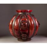 SKILLFULLY MADE, OVERLAID RED GLASS ORBICULAR LOBATED VASE, encased in hand-forged iron, 12" (30.