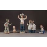 FIVE NAO PORCELAIN FIGURES, comprising: TWO CHOIR BOYS, BOY WITH CHAMBER STICK AND PUPPY, YOUNG GIRL