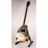 MODERN EIGHT STRING BOUZOUKI, decorated to the body with leafy scroll work, 38 ¼? (97cm) long, in