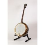 COUNTRYMAN FOUR STRING BANJO, with mother of pearl inlay to the neck, 34 ¼? (87cm)